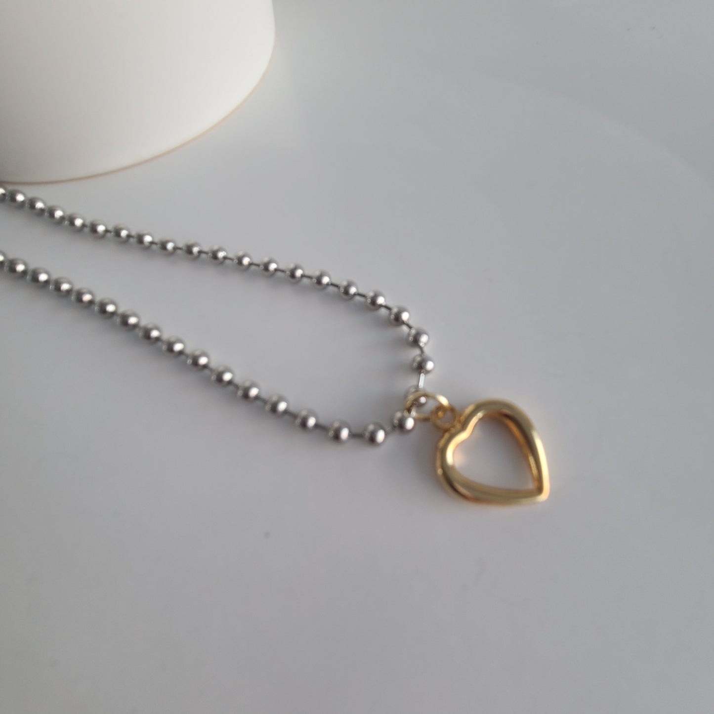 Collier coeur en argent et or