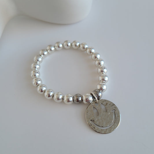 Bracelet en argent avec visage heureux