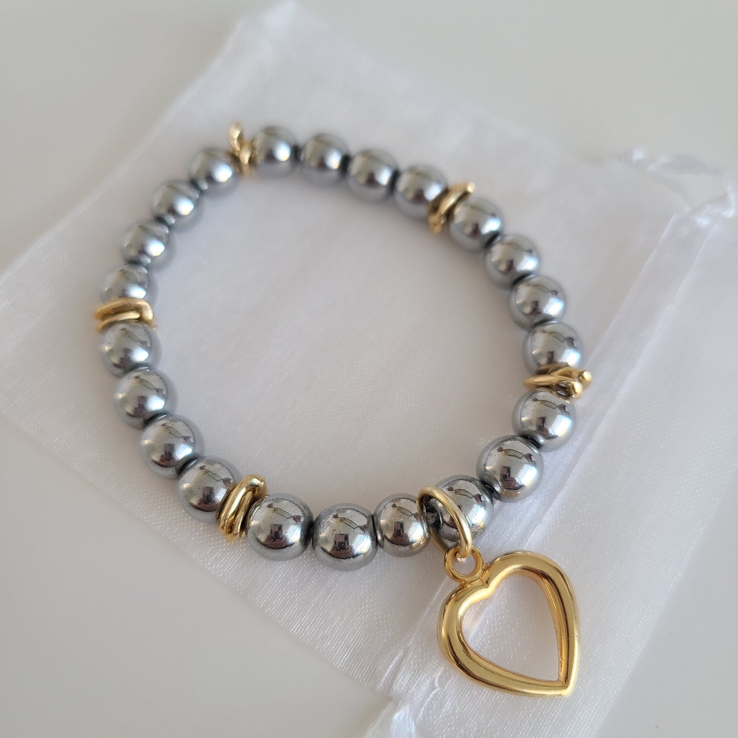 Bracelet coeur en argent foncé et or