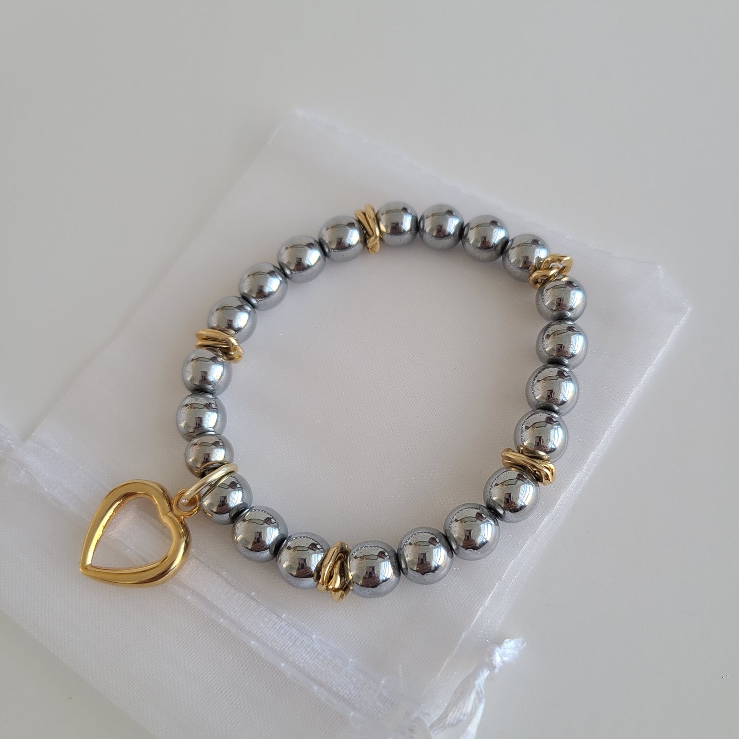 Bracelet coeur en argent foncé et or