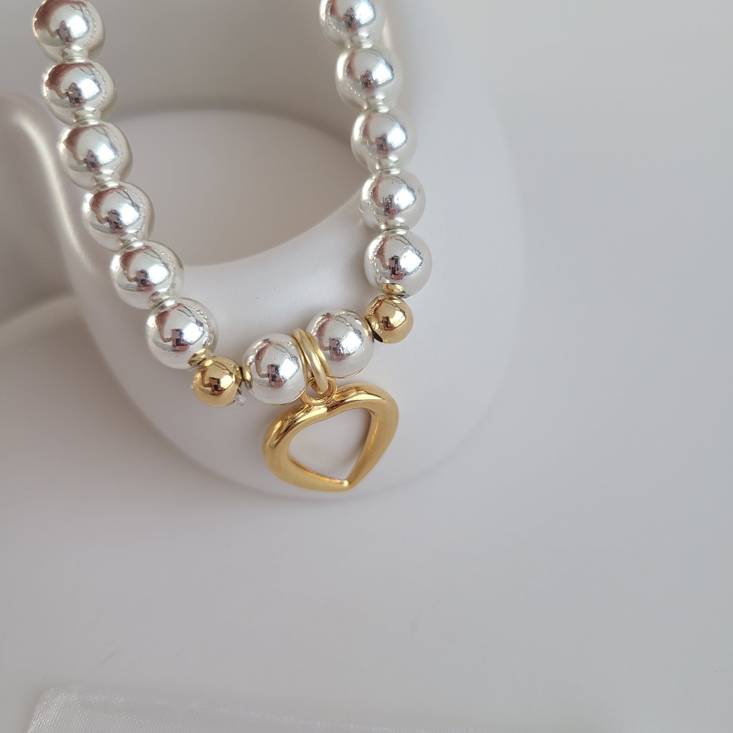 Bracelet coeur en argent et or