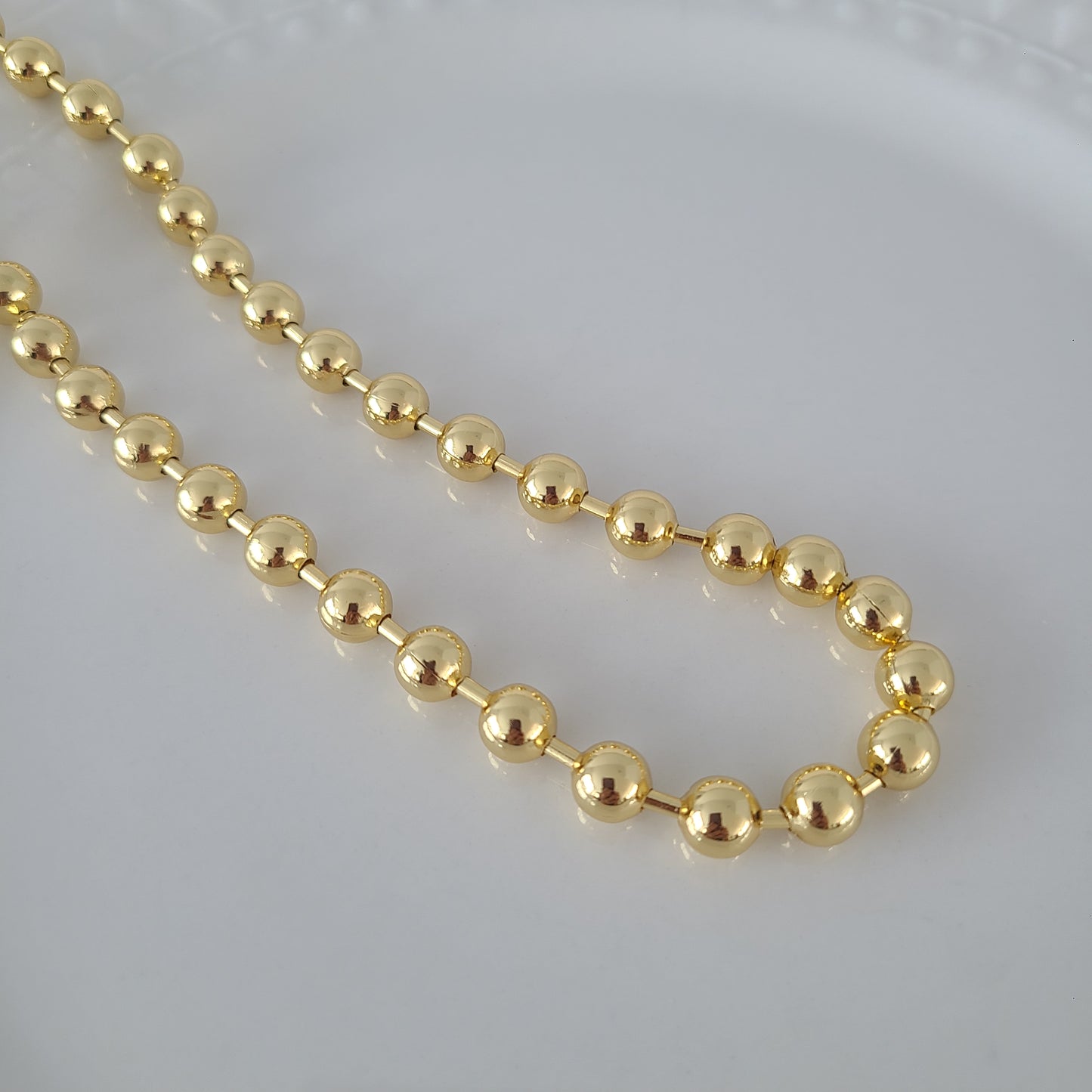 Collier de petites perles dorées